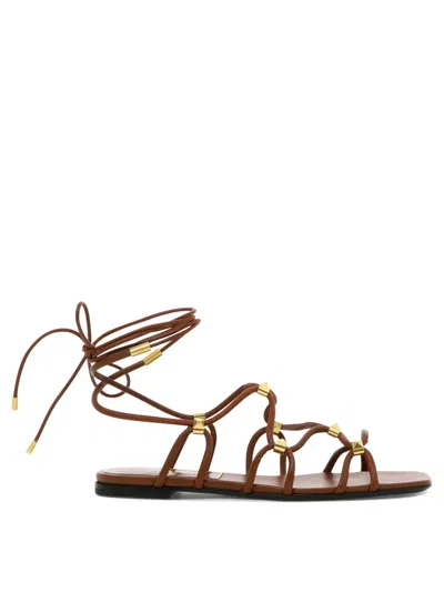 Valentino Garavani Rockstud Gladiator Leather Flat Sandals In Brown