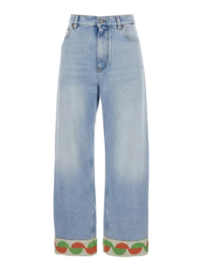 VALENTINO VALENTINO GARAVANI LIGHT BLUE JEANS WITH LOGO PATCH ON THE BACK AND JACQUARD CUFFS IN DENIM WOMAN