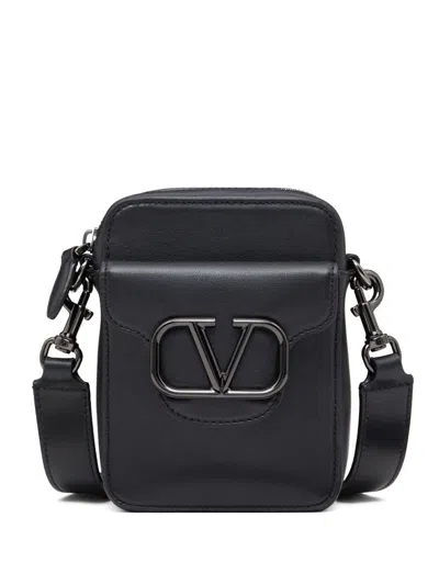 Valentino Garavani Locò Small Leather Crossbody Bag In Black