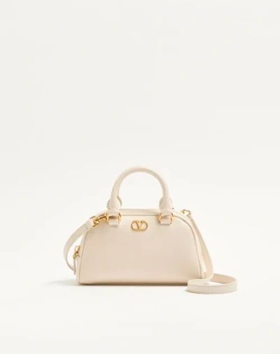 Valentino Garavani Mini Vlogo Signature Bowling Bag In Grainy Calfskin Woman Light Ivory Uni In Orange