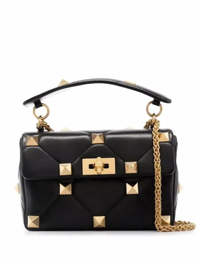 Valentino Garavani Handbags. In Black