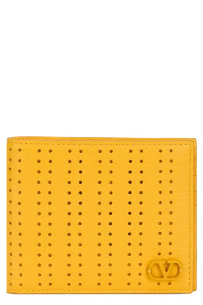 Valentino Garavani Perforated Leather Wallet In Yellow