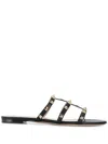 Valentino Rockstud Slide Sandal In Laminated Nappa With Cabochon In Black