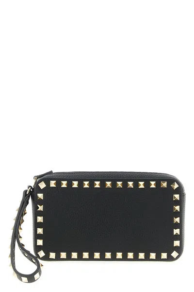 Valentino Garavani Rockstud Textured Leather Clutch Bag In Black