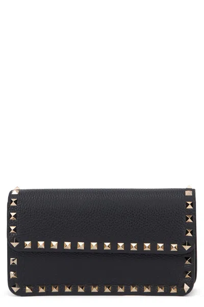 Valentino Garavani Rockstud Clutch Bag In Leather In Black