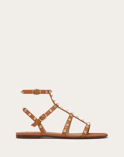 VALENTINO GARAVANI VALENTINO GARAVANI ROCKSTUD FLAT CALFSKIN SANDAL WITH STRAPS WOMAN ALMOND 40