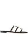 Valentino Rockstud Slide Sandal In Laminated Nappa With Cabochon In Black