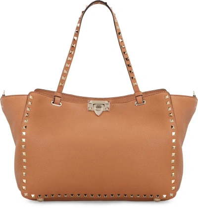 Valentino Garavani Rockstud Medium Top Handle Bag In Brown