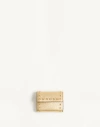 Valentino Garavani Rockstud Trifold Wallet In Laminated Grainy Calfskin Woman Antique Brass Uni In Antique Brass