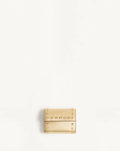 Valentino Garavani Rockstud Trifold Wallet In Laminated Grainy Calfskin Woman Antique Brass Uni