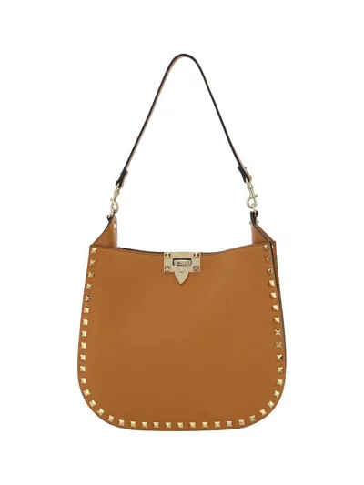 Valentino Garavani Rockstud Logo Printed Shoulder Bag In Brown