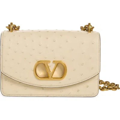 Valentino Garavani Small Devain Ostrich Leather Shoulder Bag In Neutral