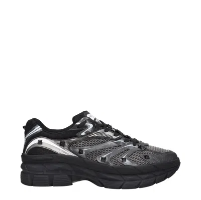 Valentino Garavani Leather Sneakers With Textured Rubber Elements In Black
