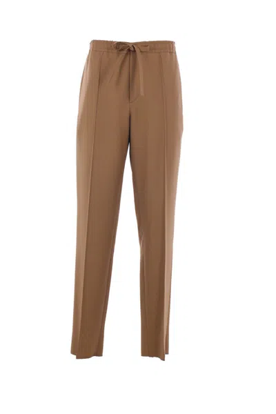 Valentino Garavani Trousers In Brown