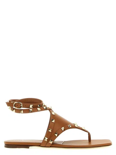 Valentino Garavani Rockstud Sandals With Flat Sole And Studded Design In Brown