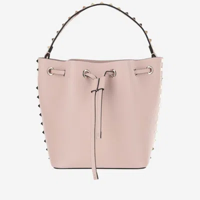 Valentino Garavani Leather Bucket Bag Featuring Rockstud Accents In Pink
