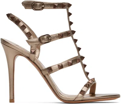 Valentino Garavani Gold Rockstud Cage Heeled Sandals In S69 Skin