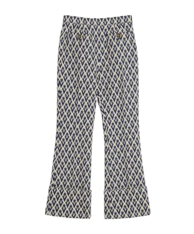 VALENTINO VALENTINO MONOGRAM PATTERNED FLARED TROUSERS