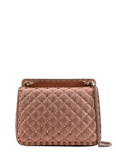 Valentino Garavani Laminated Leather Rockstud Spike Crossbody Bag In Pink