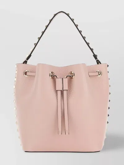 Valentino Garavani Leather Bucket Bag Featuring Rockstud Accents In Pink