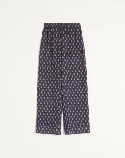 Valentino Lightweight Cuffed Linen Trousers With Voyage Imaginaire Print In Blue