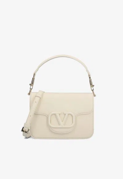 Valentino Garavani Locò Leather Shoulder Bag In Ivory