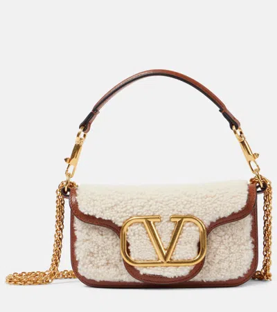 Valentino Garavani Locò Small Shearling And Leather Shoulder Bag In Brown