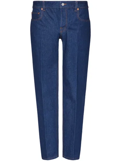 Valentino Logo-appliqué Tapered-leg Jeans In Blue