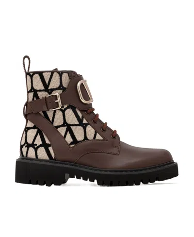 VALENTINO GARAVANI LOGO-EMBOSSED LEATHER COMBAT BOOTS
