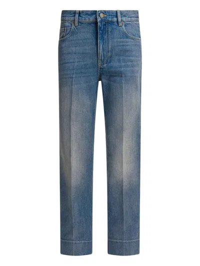 VALENTINO LOGO-PATCH CUFFED DENIM JEANS