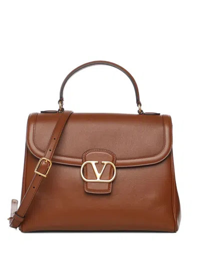 Valentino Garavani Logo-plaque Shoulder Bag In Brown