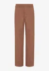 Valentino Stretch Cotton Canvas Trousers With Rubberised V Detail In Brown