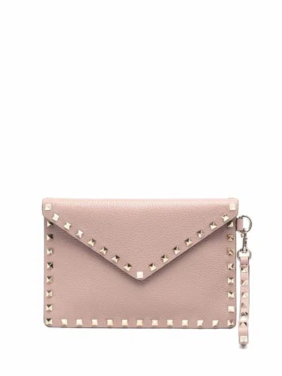 Valentino Garavani Medium Flat Pouch Handbag With Rockstud Accents In Pink