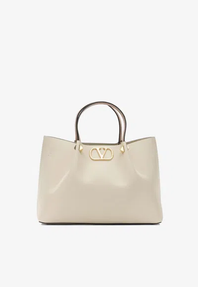 Valentino Garavani Medium Vlogo Leather Top Handle Bag In White