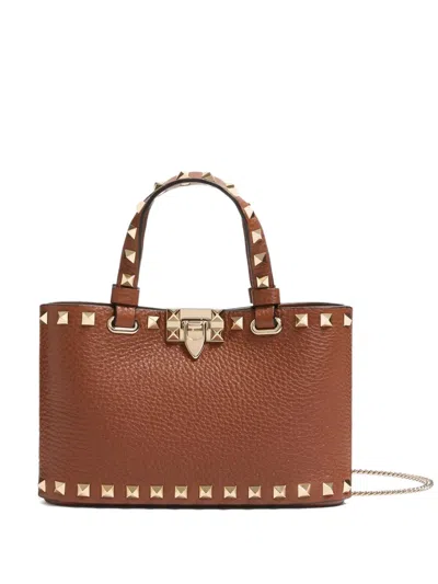 Valentino Garavani Mini Rockstud Embellished Tote Bag In Brown