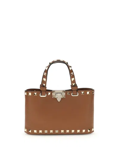 Valentino Garavani Mini Shopping Rockstud In Brown
