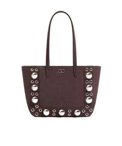 VALENTINO GARAVANI VALENTINO VLOGO PLAQUE EYELET DETAILED TOTE BAG