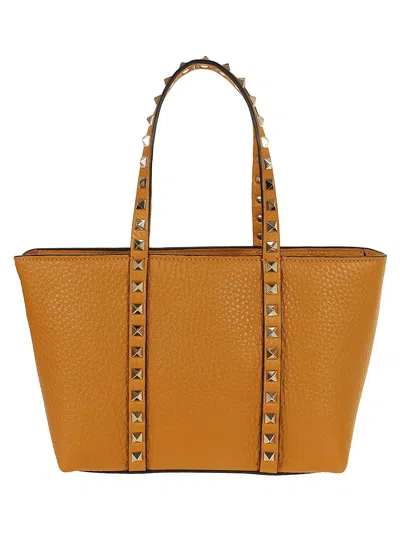 Valentino Garavani Mini Tote Rockstud In Golden Cuir