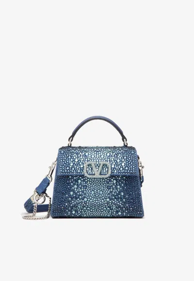 Valentino Garavani Mini Vsling Denim Top Handle Bag With Rhinestone Embellishments In Blue