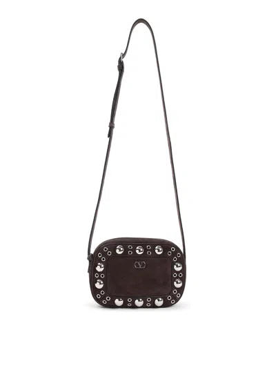 Valentino Garavani Dome-shaped Crossbody Bag With Metallic Eyelets And Adjustable Strap In Brown