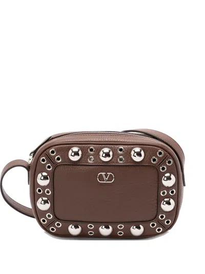 Valentino Garavani Nellcôte Eyelet-embellished Cross Body Bag In Brown