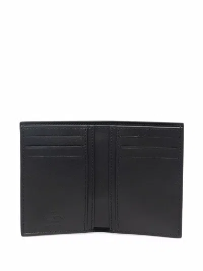 Valentino Garavani Neon Vltn Leather Half Wallet In Black