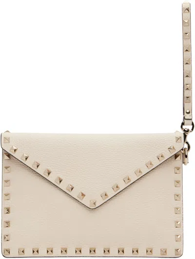 Valentino Garavani Medium Flat Pouch Handbag With Rockstud Detailing In Pink