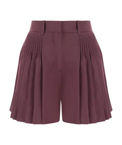 Valentino Pleated Wide-leg Shorts In Red