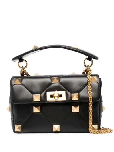 Valentino Garavani Quilted Leather Shoulder Bag With Decorative Metal Studs And Sliding Chain Strap In Black