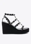 Valentino Rockstud Ankle Strap Wedge Sandal In Calfskin Leather 95 Mm In Black