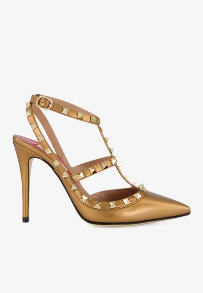 Valentino Garavani Rockstud 100 Laminated Leather Pumps In Gold