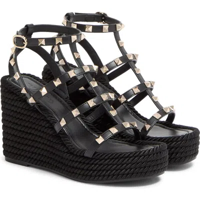 Valentino Garavani Valentino Rockstud Ankle Strap Wedge Sandal In Black