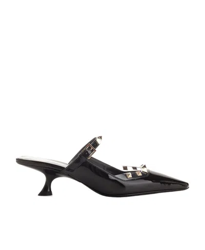 Valentino Garavani Rockstud Asymmetric Patent-leather Mules In Black