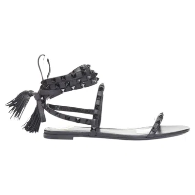 Pre-owned Valentino Garavani Valentino Rockstud Black Leather Wraparound Lace Up Tassel Gladiator Flats Eu38